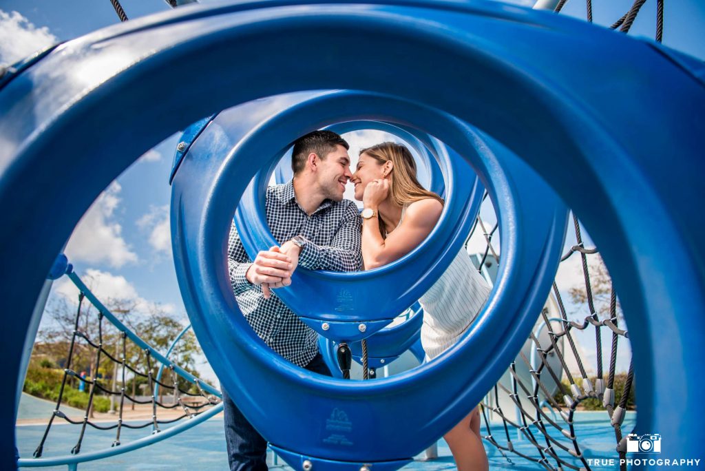 waterfront park couple standing in playground