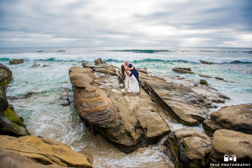 windansea elopement standing on rocks