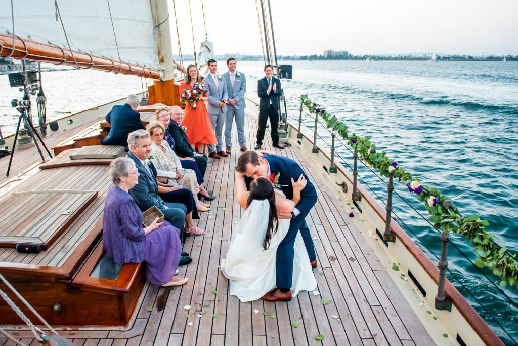 elopement wedding couple kissing on yacht