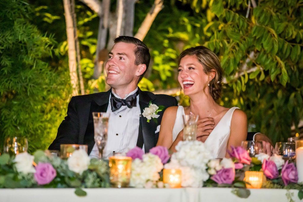 couple laughing at backyard wedding